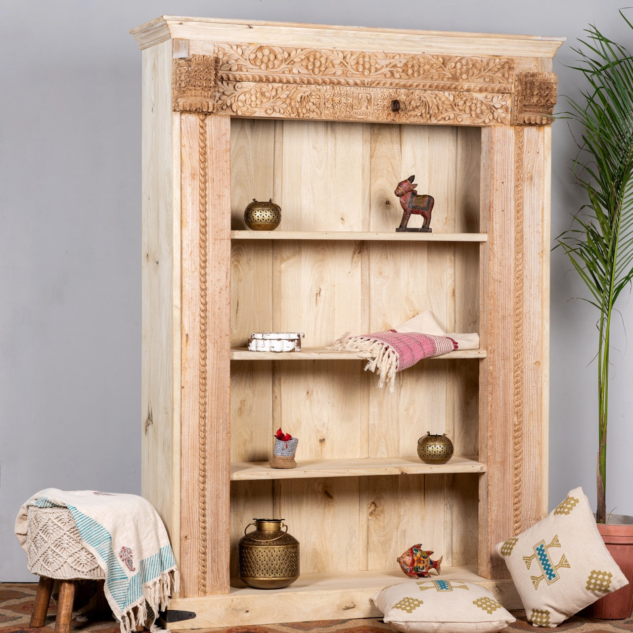 Side angle image of a hand-carved shelf made from reclaimed teak wood and mango wood, unique furniture with Ibiza-inspired finish, 152 × 206 × 51 cm. 